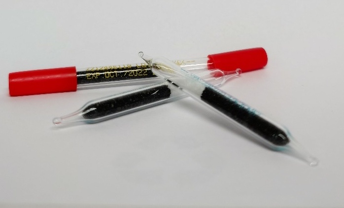 A close-up of a test tube

AI-generated content may be incorrect.