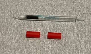 A close-up of a pen

Description automatically generated with low confidence